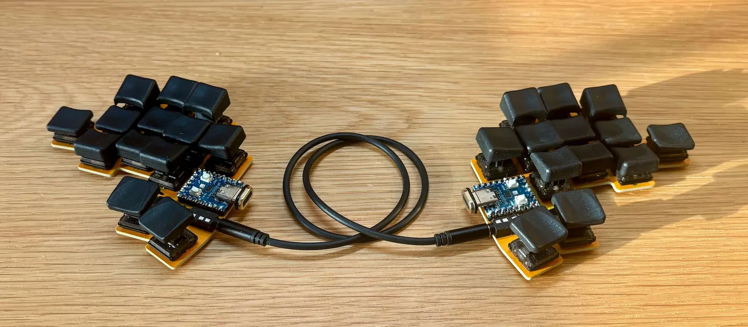 Smallcat split keyboard with two halves connected via TRRS cable