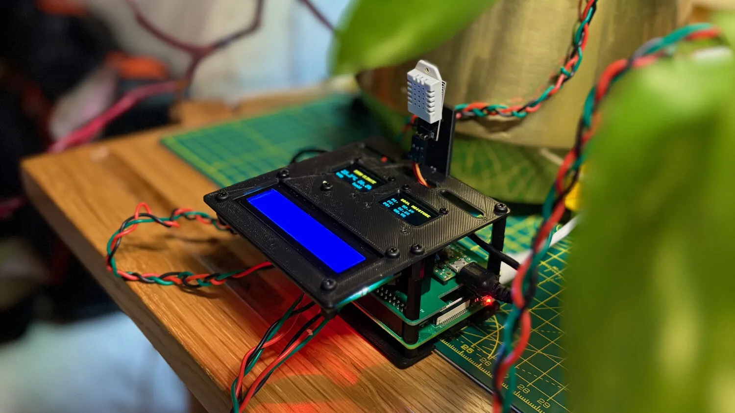 Raspberry Pi plant monitoring system with soil moisture sensors and OLED displays
