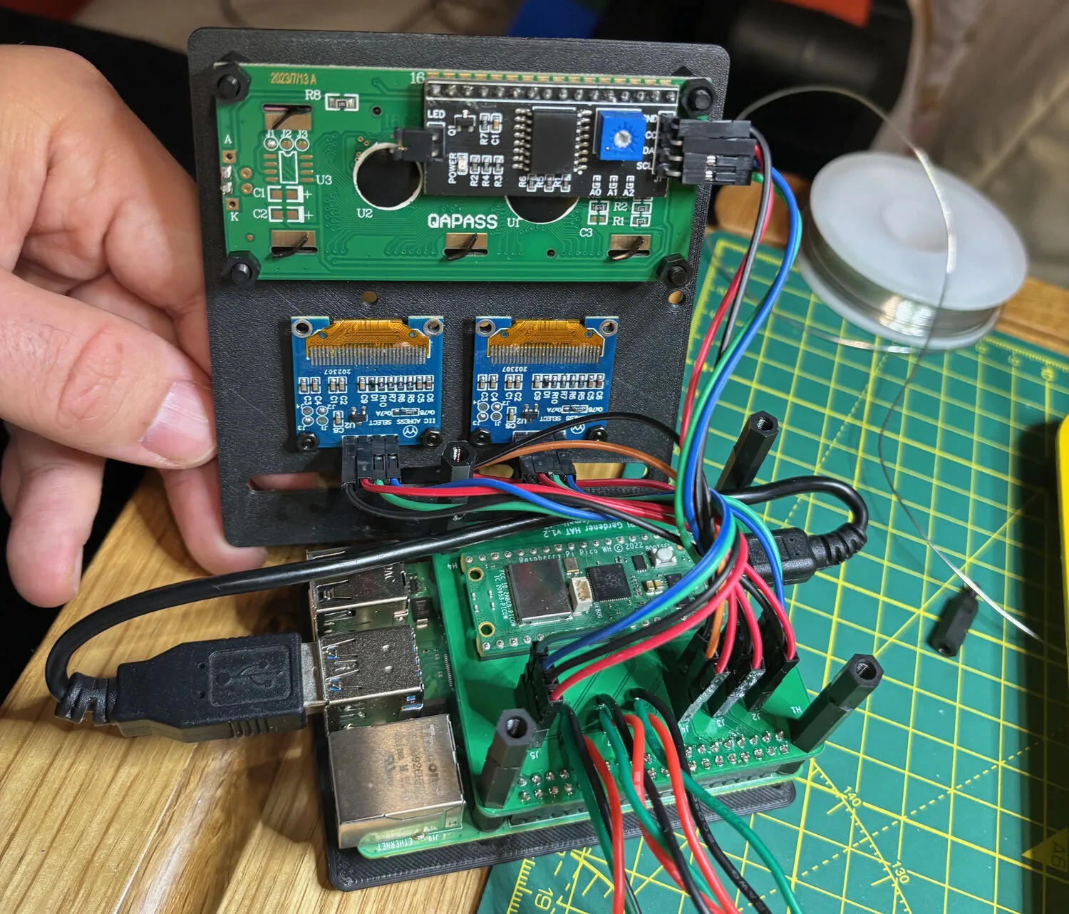 Complete assembly with 3D-printed case, OLED displays, and LCD screen